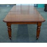 A Victorian inlaid oak extending dining table,