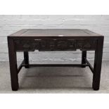 A 19th century Chinese rosewood and Jichimu (chicken-wing wood) rectangular low table with carved