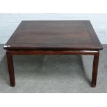 A late 19th century Chinese hardwood low square table, on block supports,