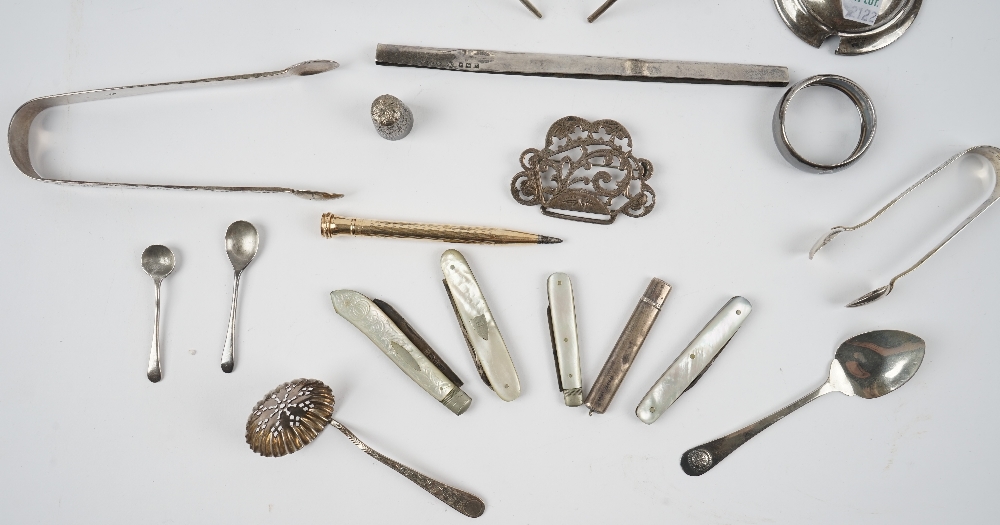 Silver and silver mounted wares, comprising; two pairs of sugar tongs, a sugar sifting spoon, - Image 2 of 3