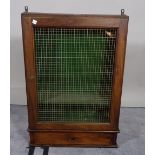 A 19th century mahogany single drawer hanging spice cupboard with mesh door, 52cm wide x 78cm high.