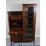 An Arts and Crafts style mahogany side cabinet with three drawers over cupboard base and glazed