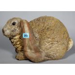 A 20th century painted stone rabbit, 38cm wide x 24cm high.