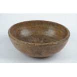 A 19th century turned sycamore bowl, 35cm diameter x 12cm high.