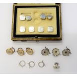 A pair of white gold and mother-of-pearl dress cufflinks, with cut cornered square backs and fronts,