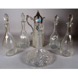 A late Victorian silver plated mounted cut glass claret jug, 36cm high, two pairs of decanters,