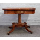 A late George III brass inlaid rosewood 'D' shaped card table on tapering square column and four