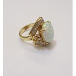 A gold, synthetic opal and colourless gem set ring,