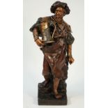 A Goldscheider terracotta figure of an inn keeper holding a large jug of ale, Ltd edition 22/73,