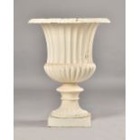 A Victorian white painted cast iron jardiniere, with flared fluted body and turned socle,
