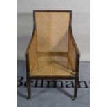 A 19th century mahogany framed bergere armchair, 58cm wide x 96cm high.