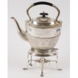 A silver spirit kettle, stand and burner, the kettle of oval form, with partly fluted decoration,