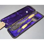A late Victorian silver plated fish server with pierced engraved decoration, cased.