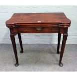 A mid-18th century mahogany triple fold-out tea and games table, with single frieze drawer,