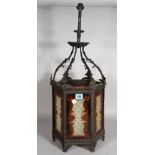 An early 20th century metal and glass octagonal hanging ceiling light, 65cm high.
