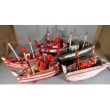 A group of nine 20th century scratch built and painted boats of various sizes,