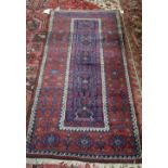 A Beluche rug, the field with five compartments, a madder flower head and plant border,