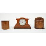 A 19th century mahogany and inlaid pin cushion of circular form with a frieze drawer and three bun