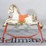 Prairie King; a mid-20th century metal painted spring rocking horse, 100cm wide x 91cm high.