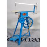 A 20th century "The Gem" treadle powered hobby saw, painted blue.