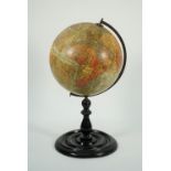 A Geographia 10 inch Terrestrial table globe, on a turned ebonised wooden stand, 46cm high.