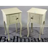 A pair of 20th century white painted bedside cupboards, 38cm wide x 70cm high, (2).