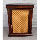 A Victorian marquetry inlaid walnut pier cabinet, with single brass grille door, on plinth base,