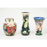 Three Moorcroft pottery items, comprising; 'Simeon' ginger jar and cover by Philip Gibson,