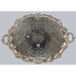 A Victorian plated on copper shaped oval twin handled tray,