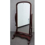 A mahogany framed cheval mirror, with arched top frame and scroll supports, 78cm wide x 155cm high.