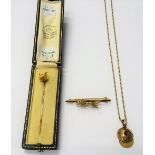 A 9ct gold bar brooch, with a running fox motif, weight 5 gms, a stick pin,