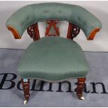 A Victorian mahogany framed tub chair on reeded turned supports, 72cm wide x 74cm high.