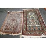 An Indian part silk rug, the ivory field with pink medallion,