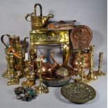 A quantity of copper and brass ware, mostly 20th century, to include jugs, kettles,