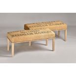 A pair of rectangular footstools, each with brass studded hessian upholstered seats,