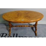 A Victorian walnut oval low table on outswept supports, 103cm wide x 55cm high,