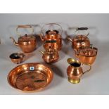 A quantity of 19th century and later copper and brass ware, including; kettles, jugs,