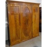 A Victorian mahogany and walnut triple wardrobe, 190cm wide x 200cm high.