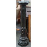 A verde marble pedestal with fluted central column, 108cm high.