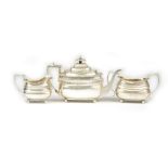A silver composite three piece tea set, comprising; a teapot, London 1807,