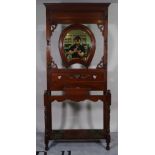 A late Victorian mahogany hall stand with oval mirror plate, 72cm wide.