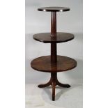 A 19th century Continental mahogany three tier dumb waiter, on tripod base,