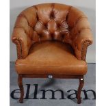 A 19th century French tub chair with brown button back leather upholstery, 68cm wide x 80cm high.