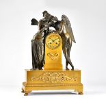 An Empire ormolu and bronze mantel clock of Cupid and Psyche The two figures leaning towards each