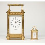 A gilt brass cased carriage clock detailed 'Vincent Weymouth' with foliate pierced frieze and