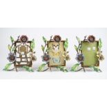 Three Jay Strongwater bronze and enamel strut back photograph frames,