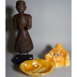 A 20th century polished hardstone figure of a Buddha, 14cm high, a matching bowl,