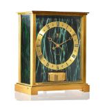 A Jaegar Le Coultre brass cased Atmos clock, "Embassy green", circa 1991, model No 5905,