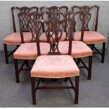 A set of eight George III style mahogany dining chairs with pierced back on block supports,