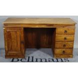 A 20th century hardwood pedestal desk with four drawers and cupboard, 150cm wide x 78cm high.